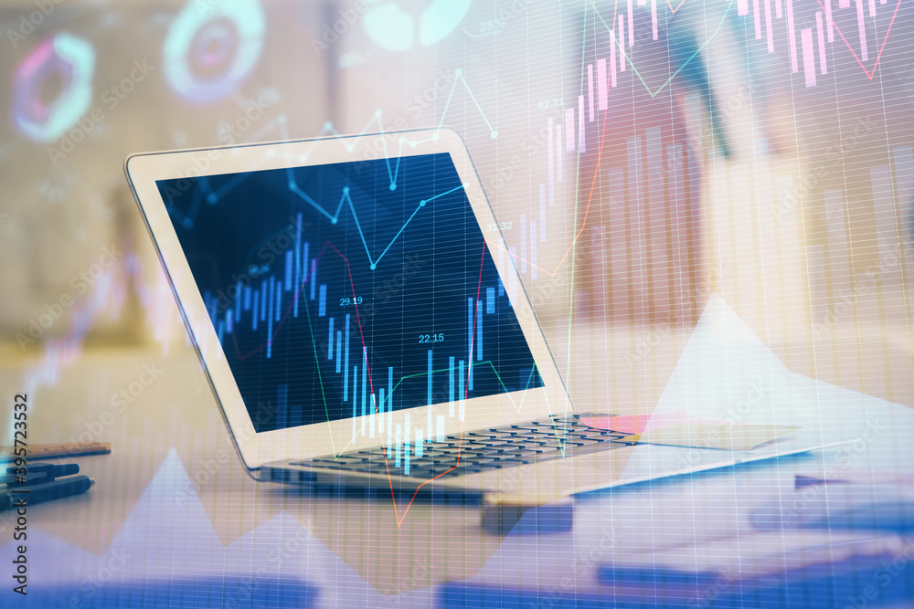 Forex market chart hologram and personal computer background. Double exposure. Concept of investment. Forex market chart hologram and personal computer background. Double exposure. Concept of investment.