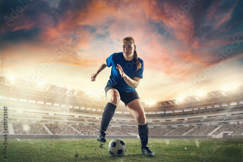 Forward. Female football or soccer player at stadium in flashlights background. Concept of sport, competition, motion, action, activity. Flyer for ad, design. 3D render. Copyspace for text.