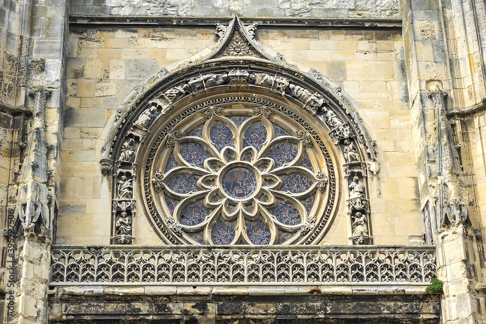 Built in heart of Fecamp XVI century Saint-Etienne church dominates now wearing Norman city: Renaissance portal, flamboyant Gothic steeple. Fecamp, Seine-Maritime department, Haute-Normandie, France.