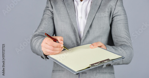 need you signature. caucasian businessman with folder at office. portrait of bearded man making notes. Confident businessman holding folder for documents. business people and corporate concept