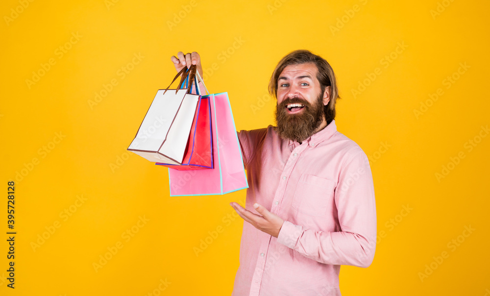 Incredible time while shopping. commonly used for birthday. buy anniversary gifts. surprised male open shopping bag with something exciting inside. mature man looking casual in surprise with package Incredible time while shopping. commonly used for birthday. buy anniversary gifts. surprised male open shopping bag with something exciting inside. mature man looking casual in surprise with package