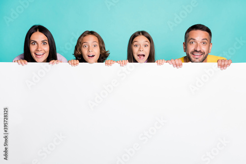 Photo portrait of shocked screaming full family with small kids isolated on vivid turquoise colored background with copyspace