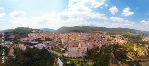 Panoramic aerial view of Narni (Terni, Umbria, Italy), medieval city with a rich history. Houses made of stone on top of the mountain. Incredible views. Summer day. Europe travel and vacation concept