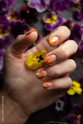 Hand of the girl with flowers