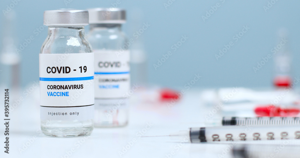 Vaccine and syringe injection in the laboratory. Research and development of new cure for diseases