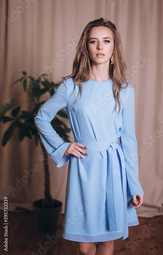 Young beauty woman portrait in blue fashion dress. Wedding, ellegance, fashion concept