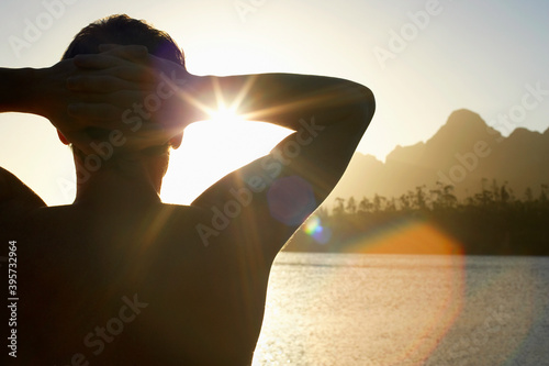 Man Relaxing By Lake photo