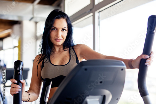 Fit long dark hair woman exercise at the gym wearing sportwear © pucko_ns