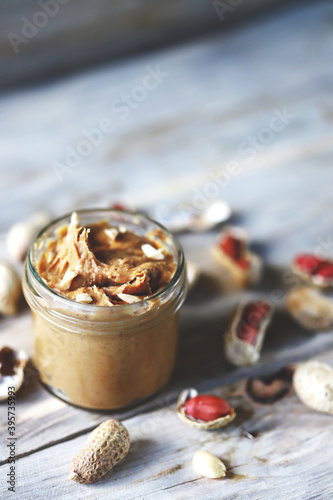 Peanut butter in a jar. Peanuts in shells.