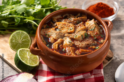 Traditional mondongo or el menudo soup on wooden table photo
