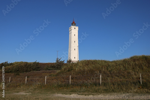 Beautiful view of the Blavandshuk lighthouse in Jutland, Denmark photo