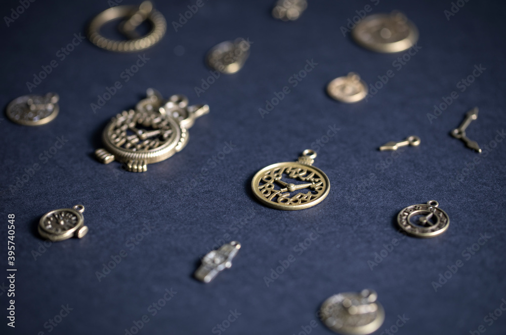 Various figurines of clocks on a blue background Various figurines of clocks on a blue background