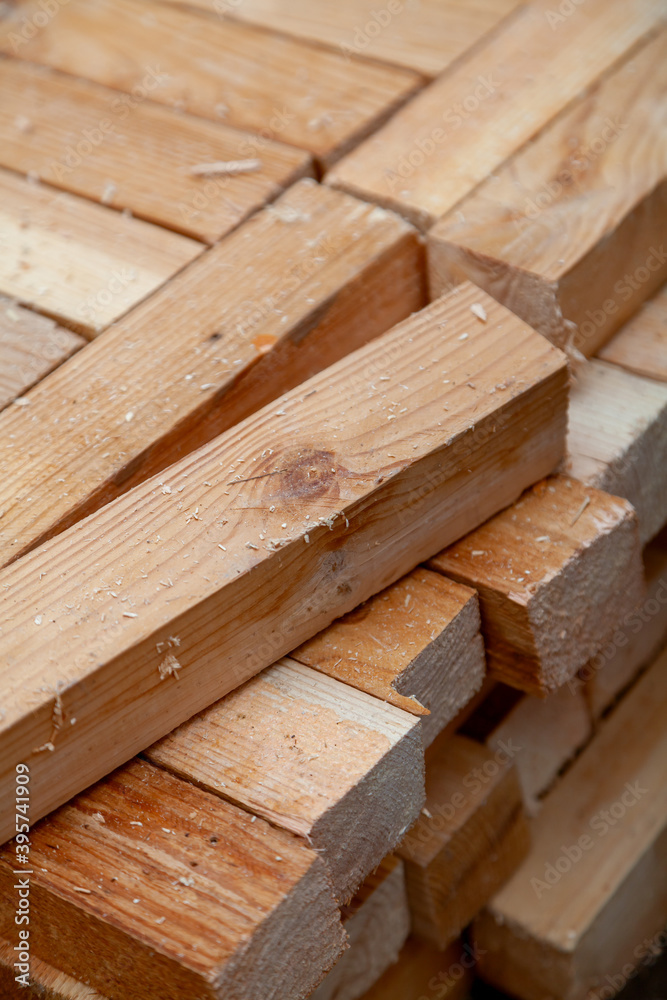 Square wooden planks stacked in rows Square wooden planks stacked in rows