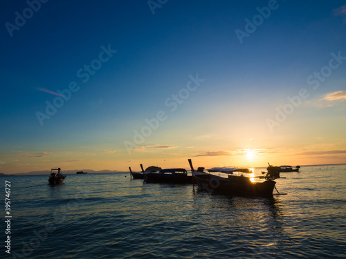Boat on sea beach colorful sky sunset nature vacation landscape © themorningglory