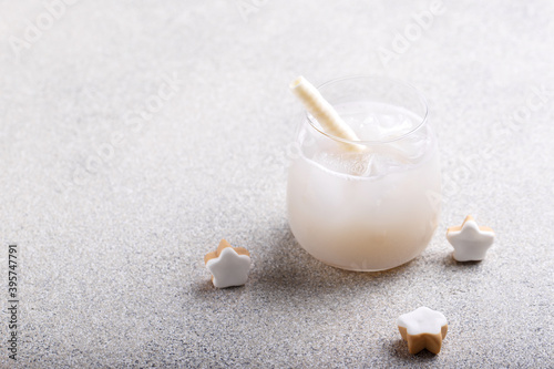 Glass of fresh cold lychee juice with ice photo