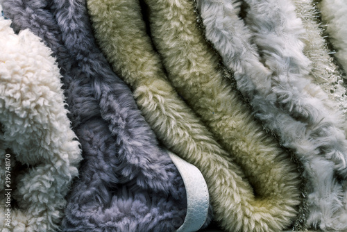 Wool fabric. A soft and warm blanket. Material for the production of clothing. Cloth samples close up. Textile background.