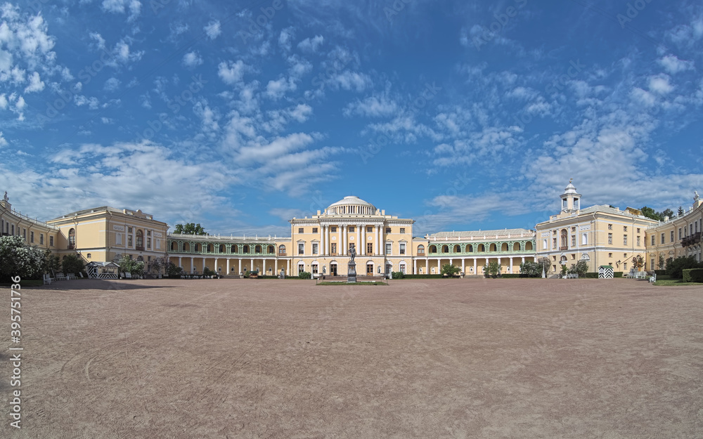 Pavlovsk, Saint Petersburg, Russia. Panoramic view of Pavlovsk Palace, the 18th-century Russian Imperial residence built for Emperor Paul I of Russia, whose statue stands in the courtyard.