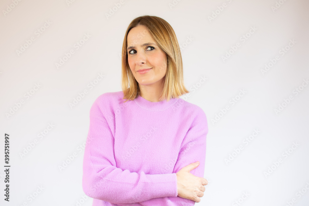 Portrait of a pensive casual woman looking away at copy space isolated over white background Portrait of a pensive casual woman looking away at copy space isolated over white background