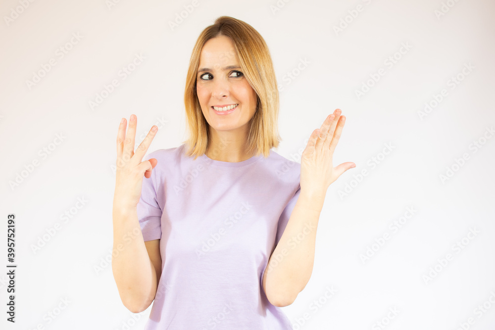 Beautiful young woman wearing casual clothes showing and pointing up with fingers number eight while smiling confident and happy. Beautiful young woman wearing casual clothes showing and pointing up with fingers number eight while smiling confident and happy.