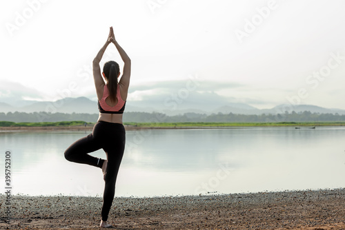 Yoga women lifestyle exercise and pose for healthy life. Young girl or people pose balance body vital zen and meditation for workout sunrise morning nature background. 