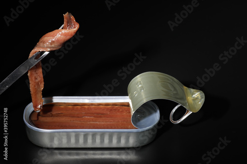 Cantabrian anchovies in can with black background