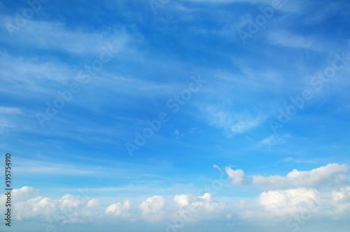 A clear blue sky with white clouds © alinamd