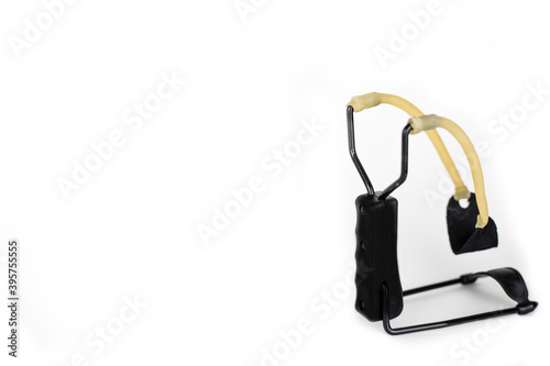 Isolated toy slingshot for shooting bullets on white background