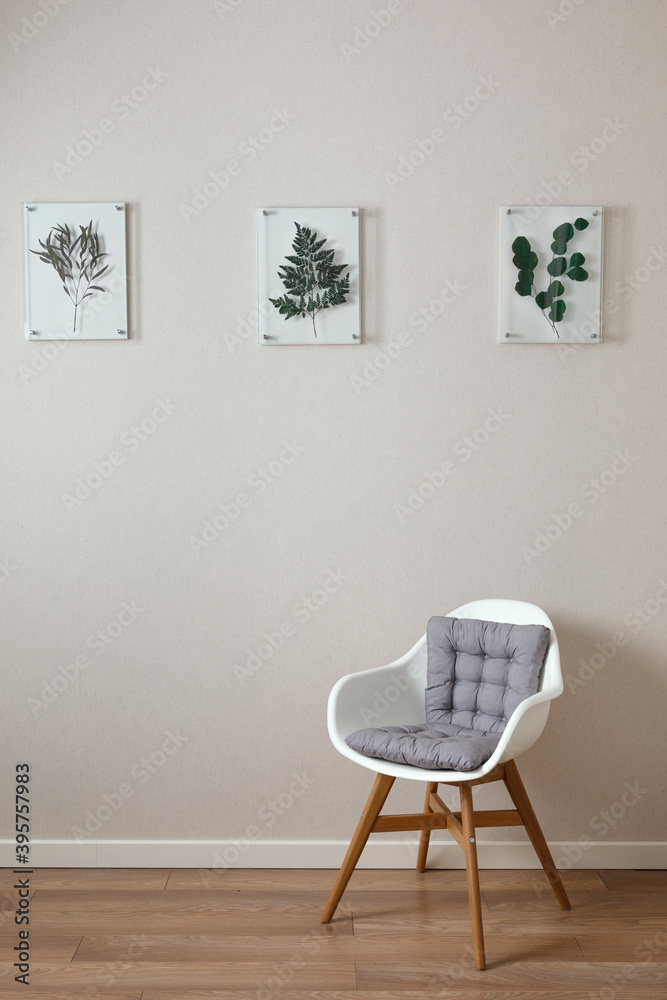Fototapeta premium The interior of the apartment. wall with frames with plants