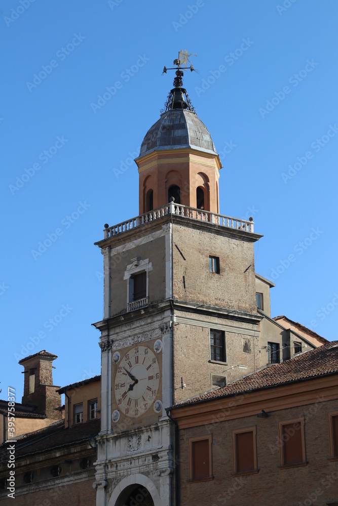 Municipal historical tower with ancient clock, Modena, Italy