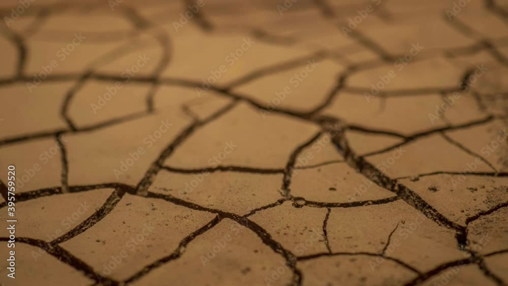 global climate change and drought. timelapse evaporation from soil. dry, cracked earth, low reservoir levels. increased temperatures, global warming, dry regions become drier. environment and ecology