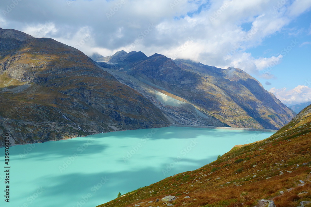 Mountain lake Mattmark ( Stausee Mattmark) in Saas Valley surrounded by glaciers next to Zermatt, Switzerland