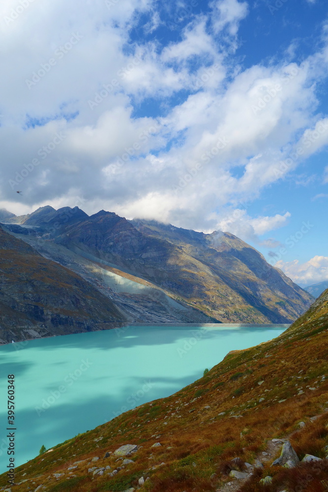 Mountain lake Mattmark ( Stausee Mattmark) in Saas Valley surrounded by glaciers next to Zermatt, Switzerland