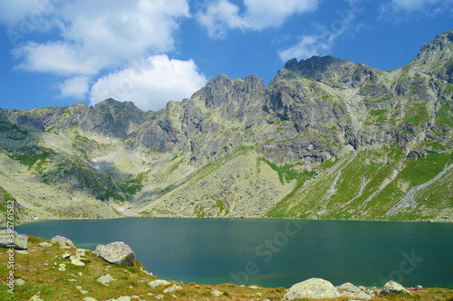 Velke Hincovo pleso, the biggest mountain lake in High Tatras surrounded by Rysy and Koprovsky Stit, Slovakia photo