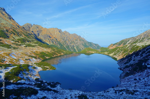 View of mountain lake called Wielki Staw Polski in Five Polish Ponds Valley from a peak of Szpiglasowy Wierch mountain in High Tatras national park, Poland photo