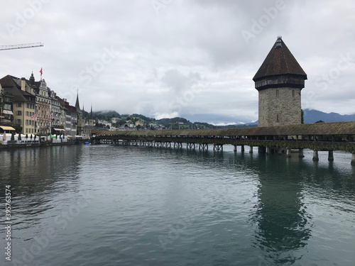 Historic city center of Lucerne with famous Chapel Bridge on Reuss River in Switzerland © April Wong