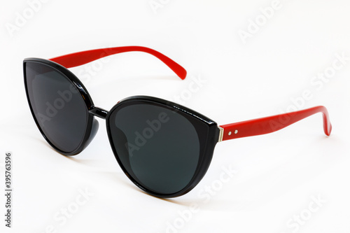 sunglasses with red temples on a white background