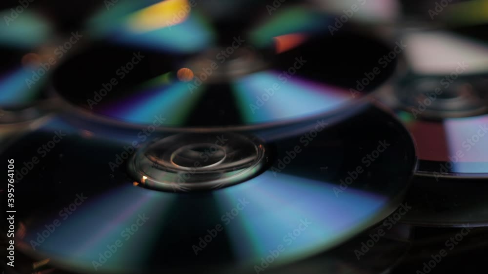 Close Up of CD and DVD Recordable Digital Media, Vintage Data and Video Storage. Full Frame Spinning Close Up of CD and DVD Recordable Digital Media, Vintage Data and Video Storage. Full Frame Spinning