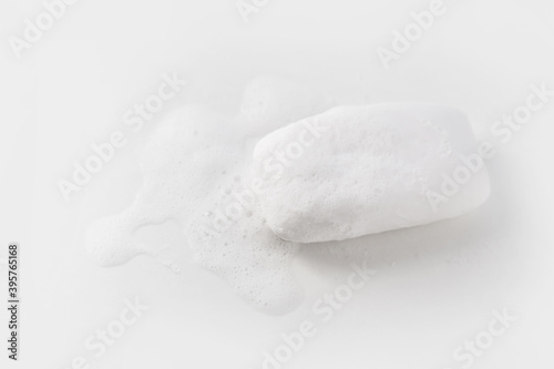 Soap with foam on a white background Soap used in everyday life, including washing, bathing