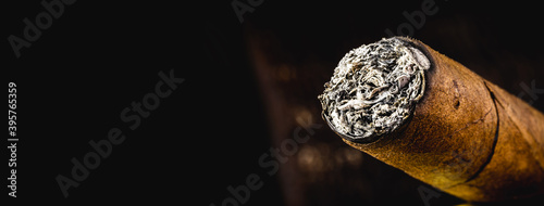 cigar tip detail, isolated on dark background