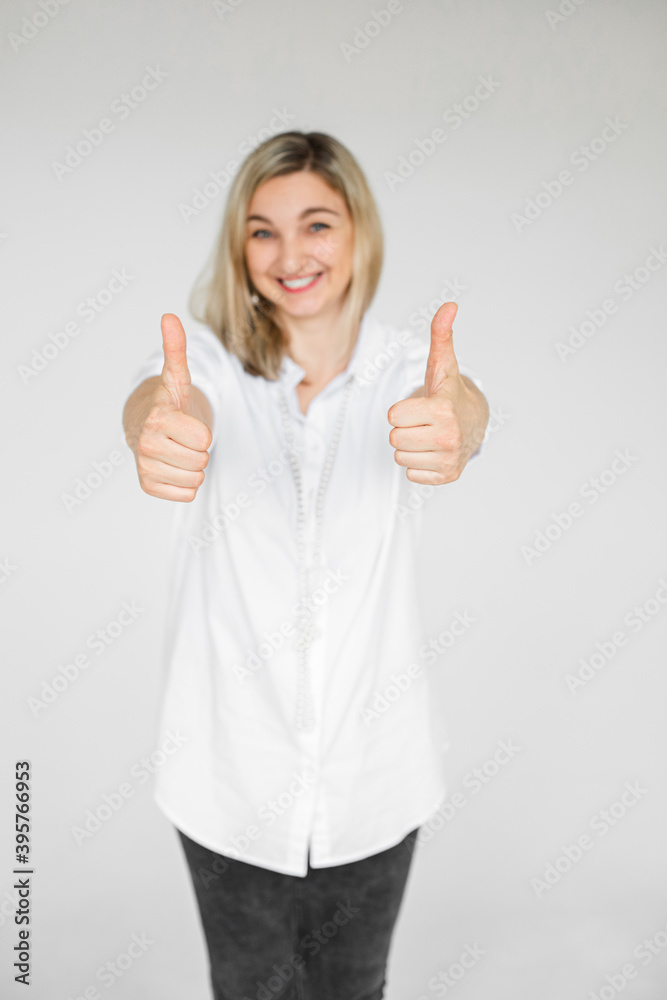 Attracrive caucasian woman with blonde hair smiles and like something isolated on white background Attracrive caucasian woman with blonde hair smiles and like something isolated on white background