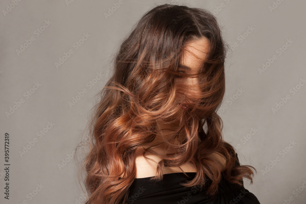 Beautiful woman with long brown curly hair. Beautiful woman with long brown curly hair.