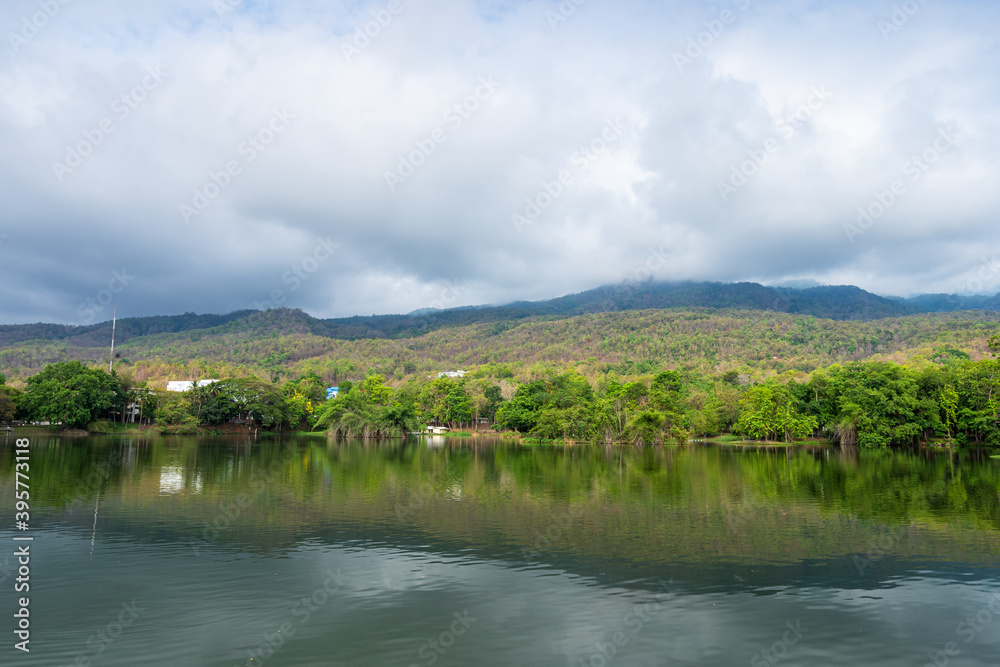 landscape lake views at Ang Kaew Chiang Mai University in nature forest Mountain views spring blue sky background with white cloud.