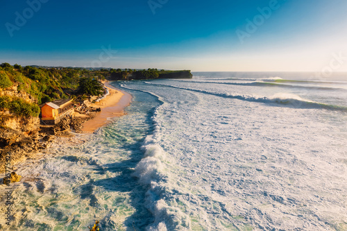 Balangan beach at Bali with big waves in ocean. Perfect waves for surfing and beach photo