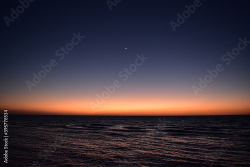 Sunset and crescent over the Red Sea  Jeddah  Saudi Arabia 
