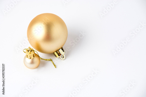 Christmas decor two shiny golden balls on white background