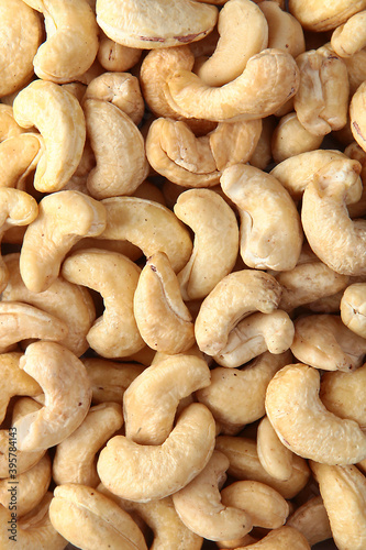 Cashew nuts, without shells, in large quantities. Natural product. The view from the top. Copy space.