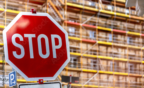 Stop sign in front of scaffolding