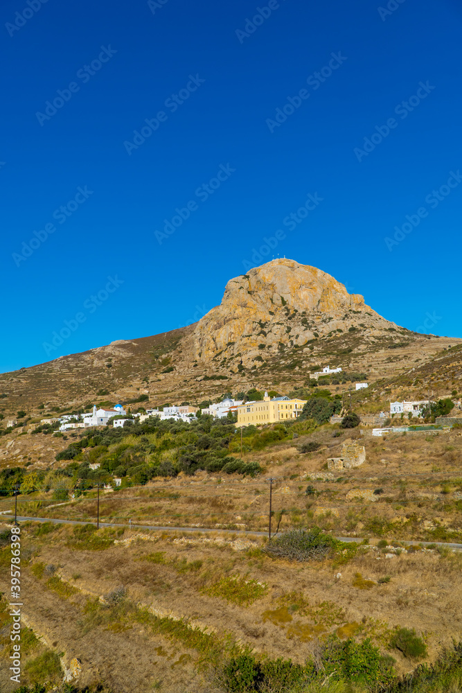 Vertical view of the village of Volax on the Cycladic island of Tinos, Greece with a rocky mountain in the background