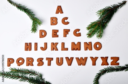 Gingerbread christmas alphabet with Christmas decorations and attributes on the white background