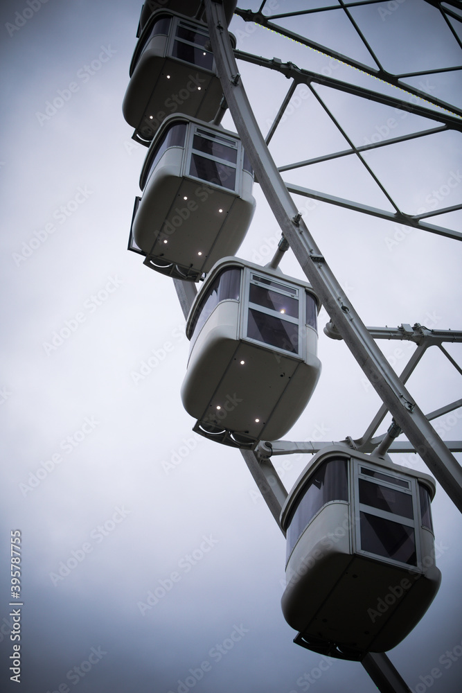 big ferris wheel against a cloudy sky big ferris wheel against a cloudy sky